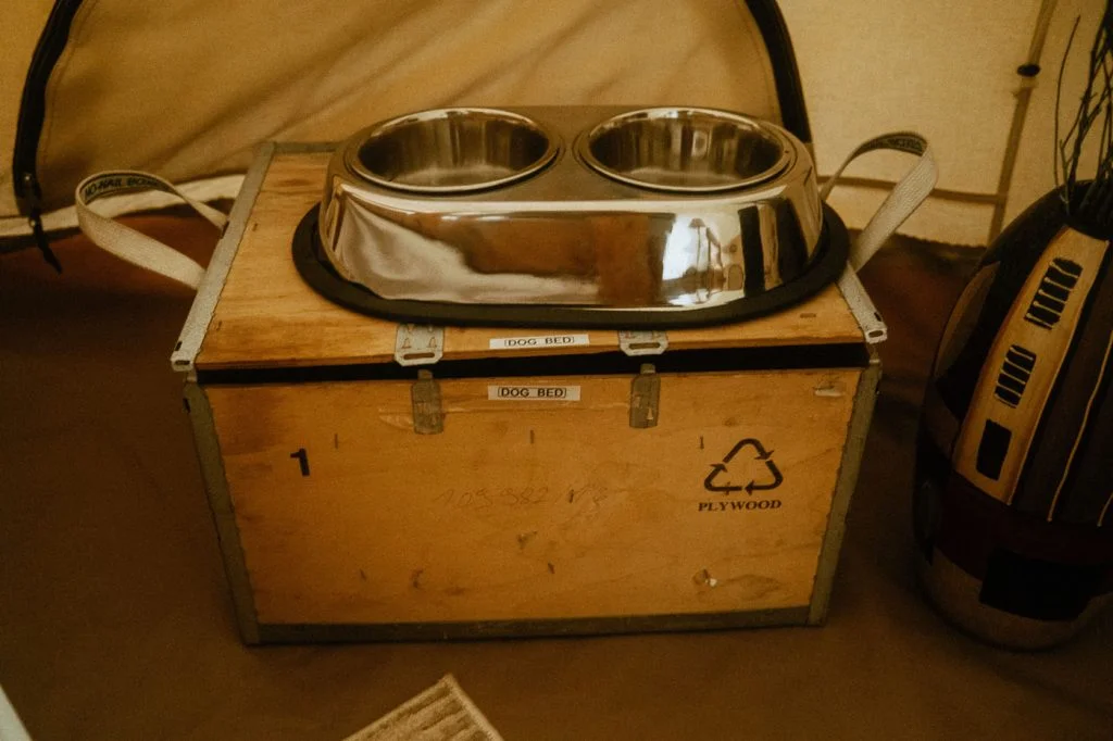 Interior of Sibo's Bell Tent in Verona, Ontario also comes with dog accessories like a dog water bowl and food bowl, and a dog bed