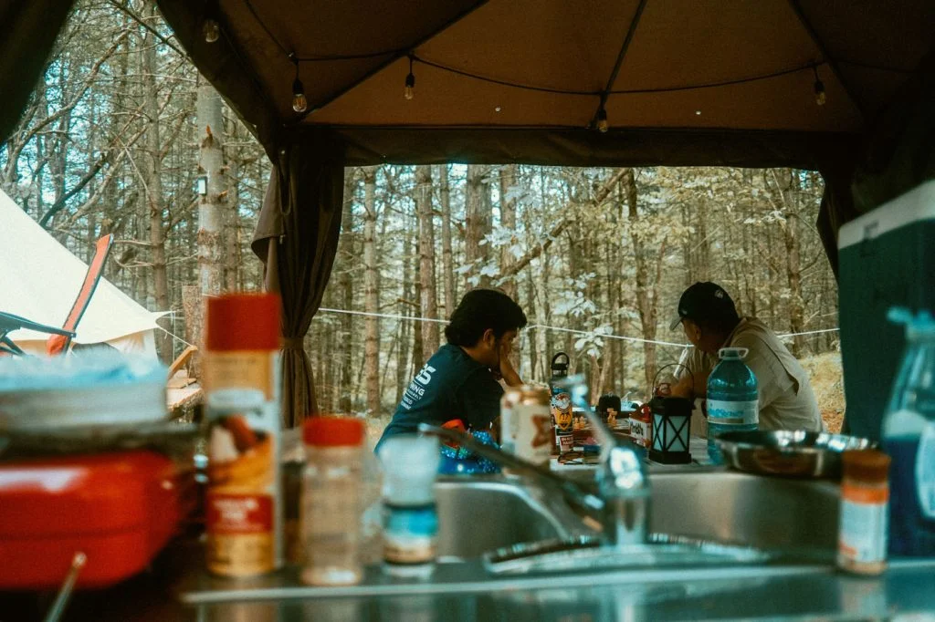 View from the kitchen sink area of the sheltered picnic area at Sibo's Bell Tent Glamping in Verona, Ontario