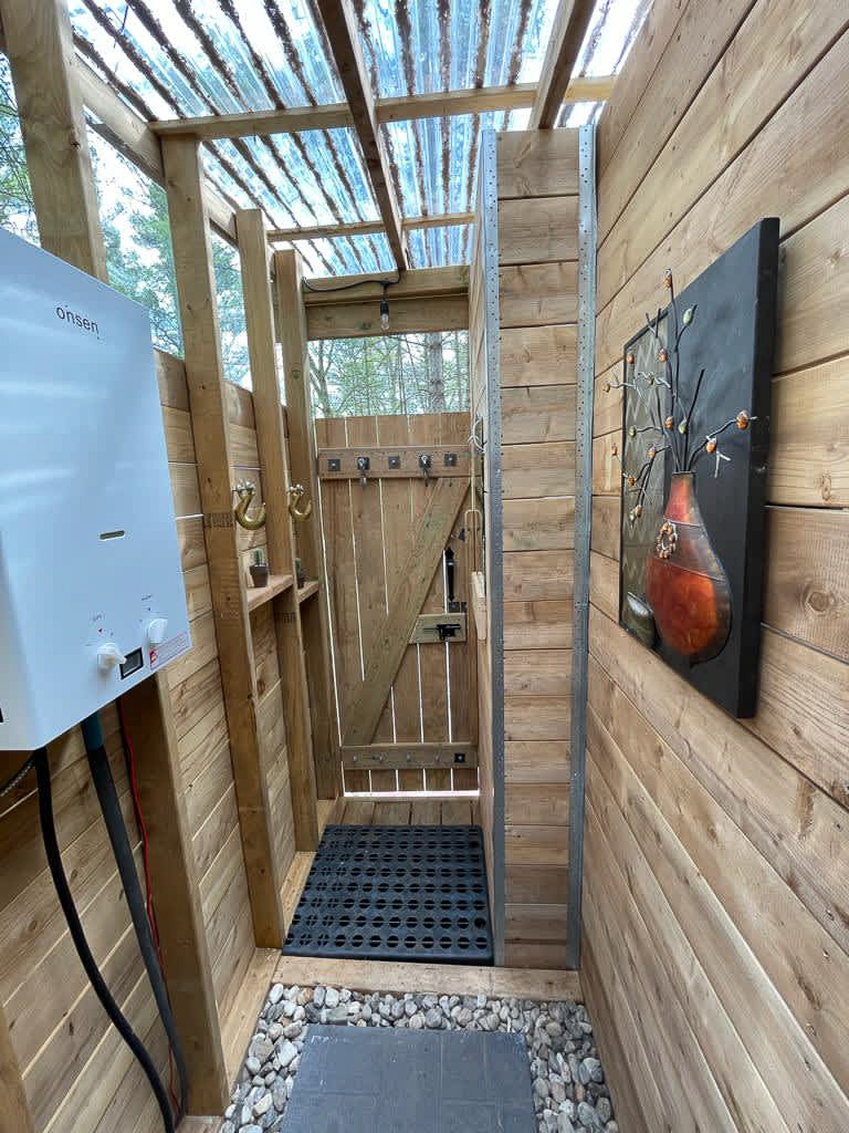 Outdoor shower entryway at Sibo's Bell Tent Glamping in Verona Ontario