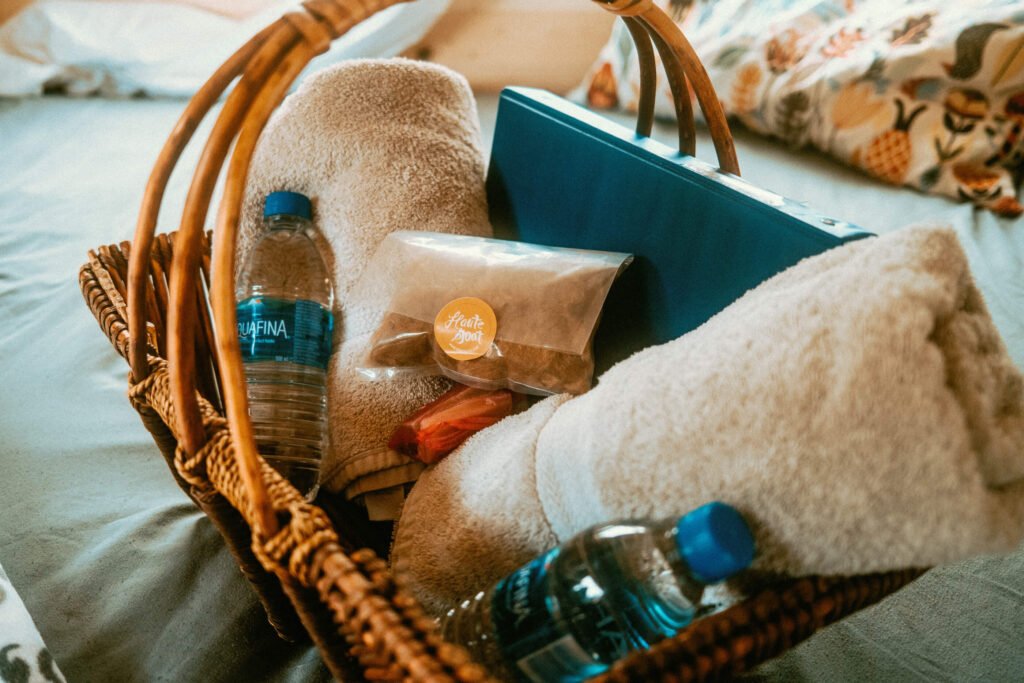Welcome Basket with water bottles, towels, alpaca fibre, and an information binder - for Alpaca Sleepover Guests at Haute Goat