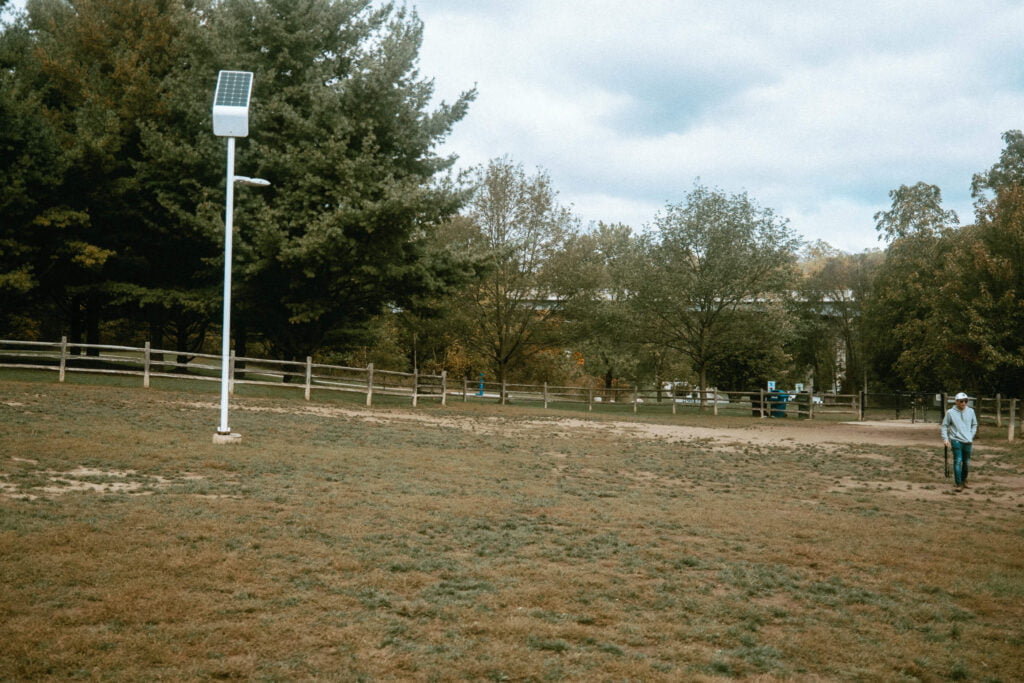 A single solar lamp is situated near the main entryway at Earl Bales Dog Park