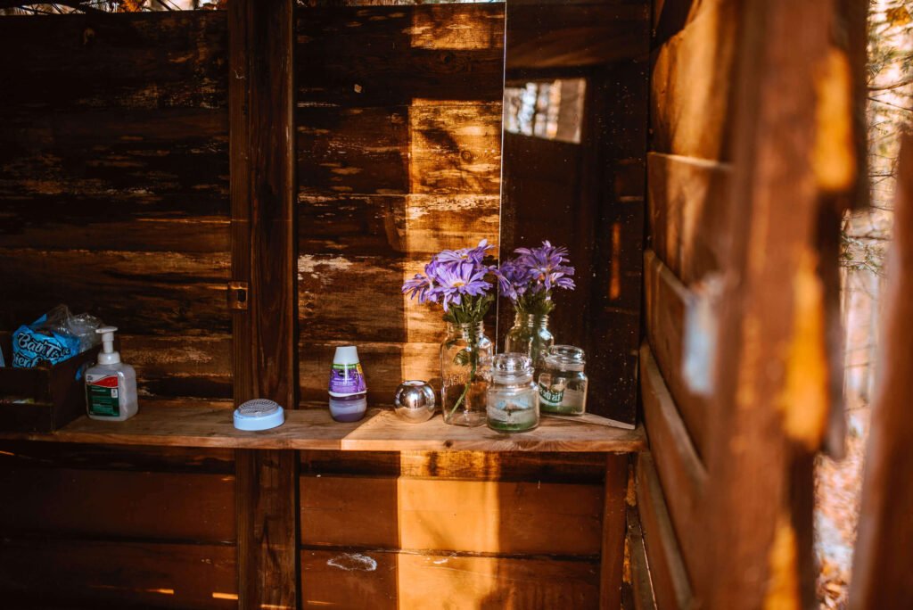 Alternate view of Entrance of the outhouse at the rustic cozy cabin in Minden, Ontario - Hipcamp Caanada listing